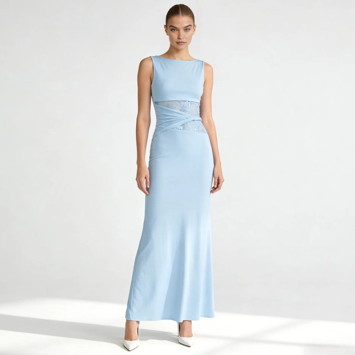 Model wearing the Kouvr Fashion Deborah Gown in light blue, showing the front view with bateau neckline and asymmetric lace waist detail.