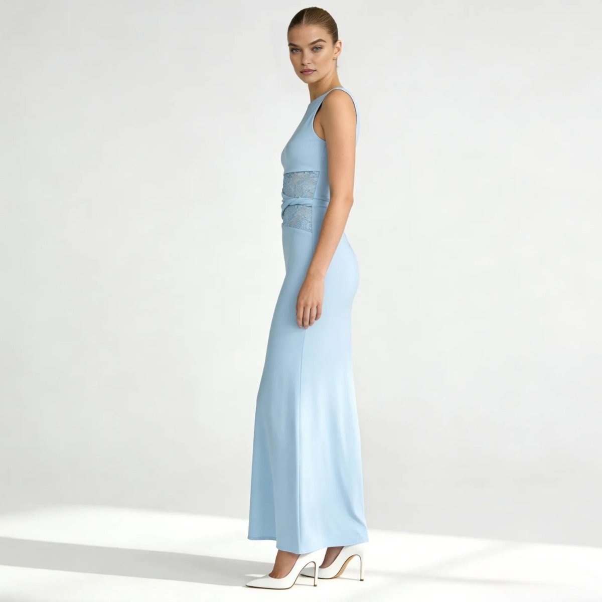 Side profile of the light blue Deborah formal gown, highlighting the sleek column silhouette and lace paneling at the waist.