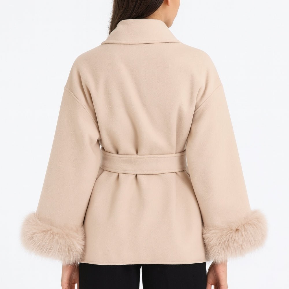 Close-up back view of the Kouvr Fashion Emma beige coat, showing the collar construction and belt loops.