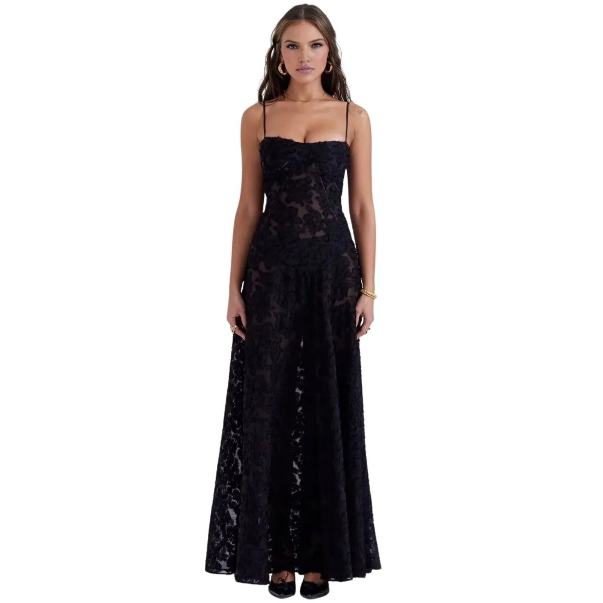 Woman wearing a black Kouvr lace evening gown on a white background