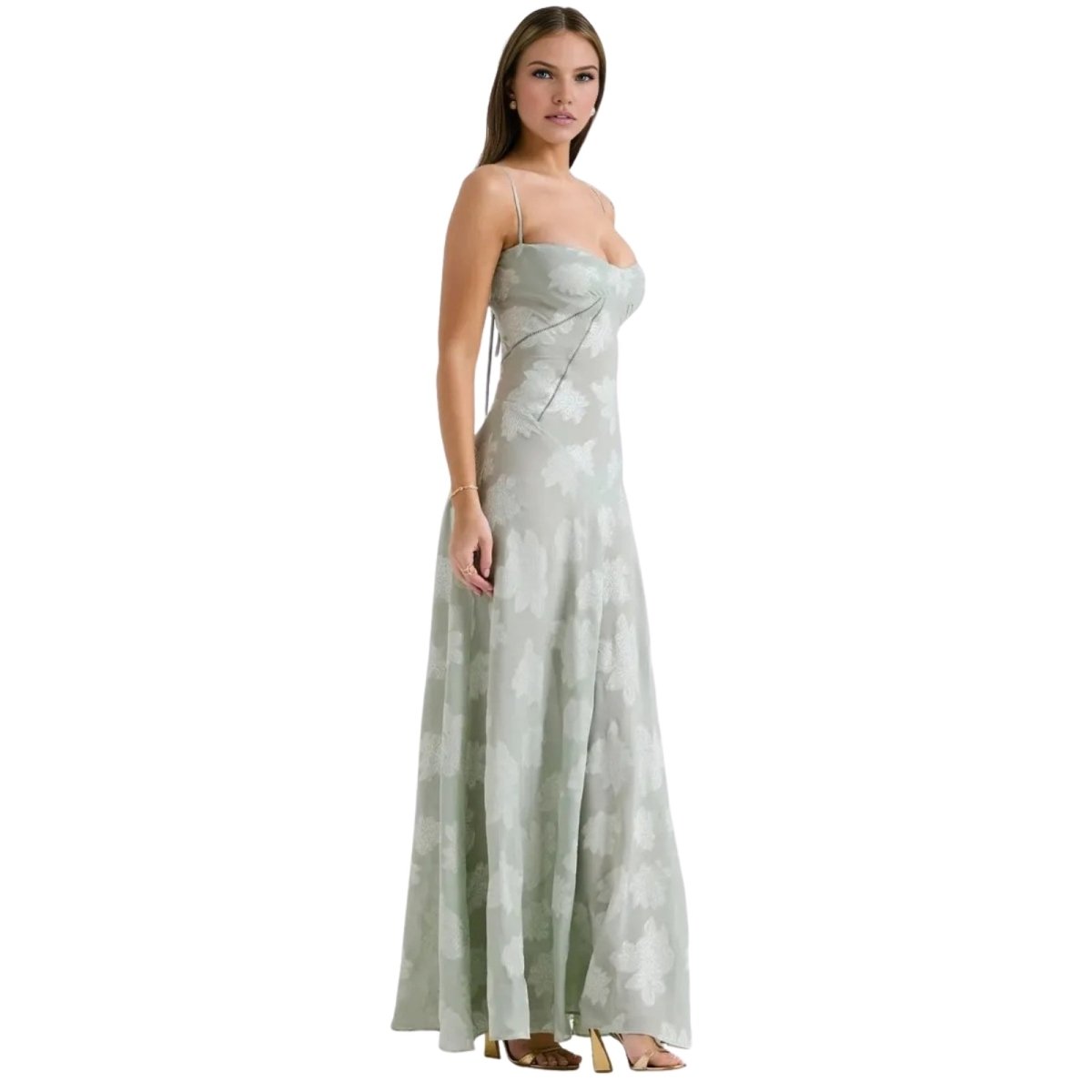 Woman wearing a strapless, light-colored Kouvr evening gown on a white background