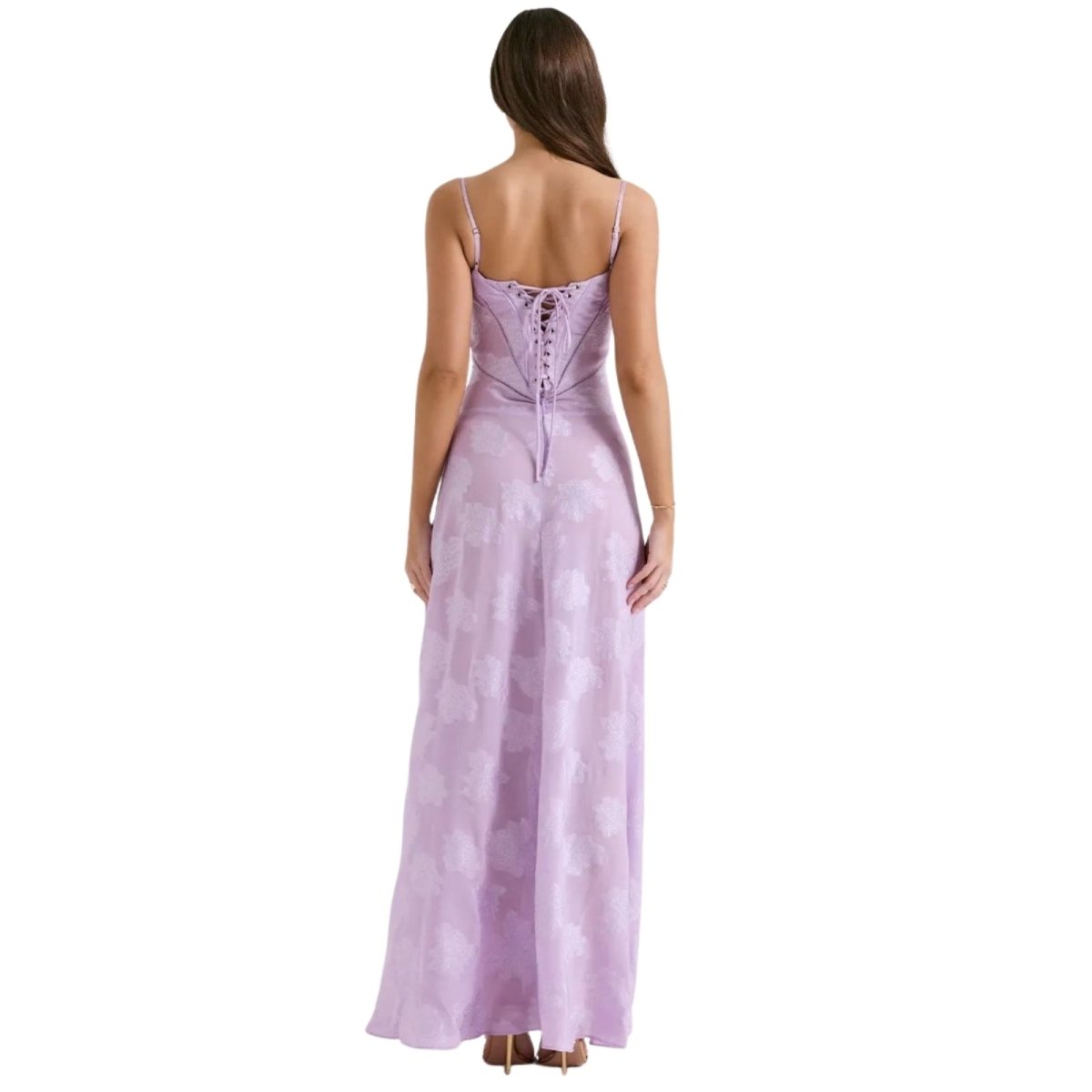 Woman wearing a purple Kouvr evening gown on a white background