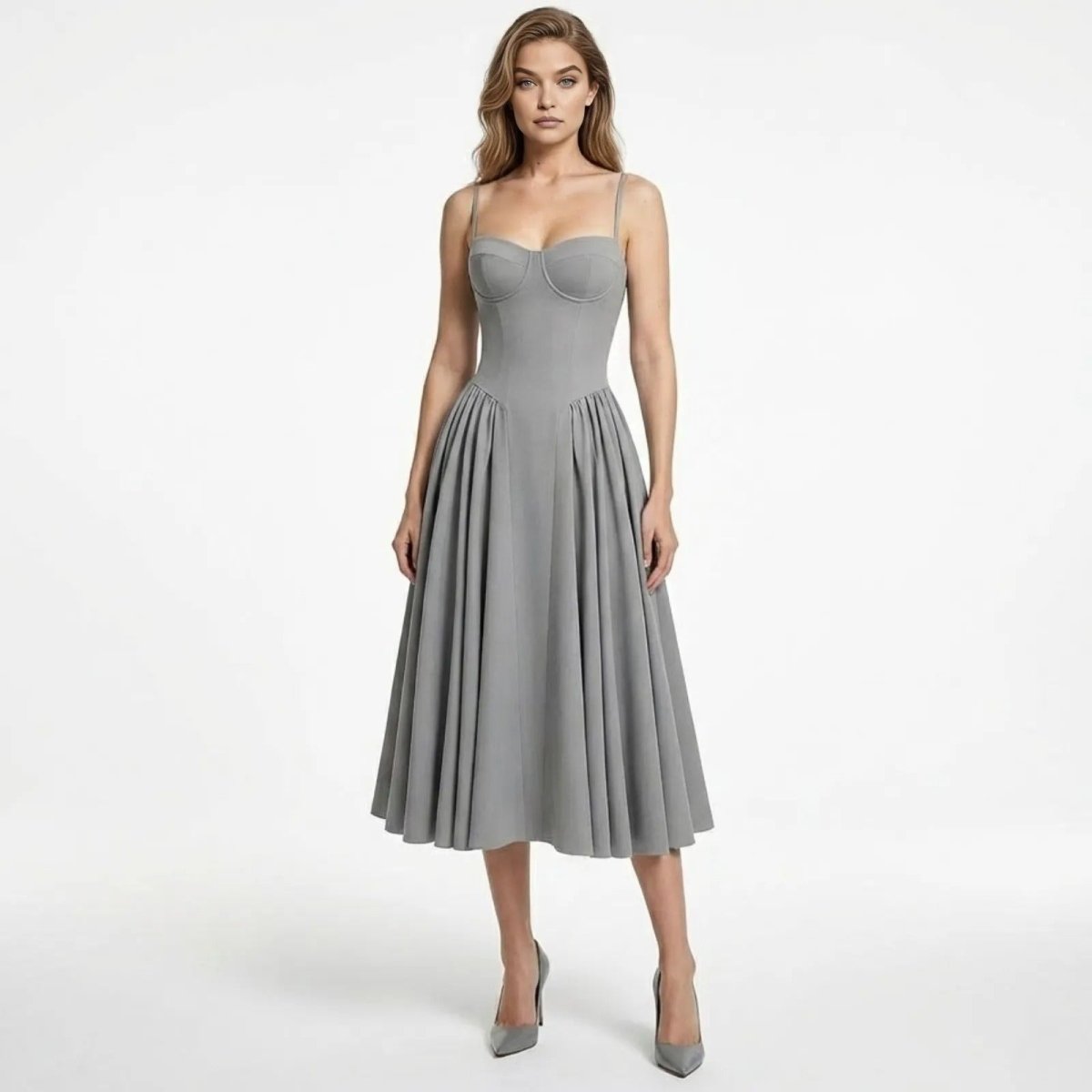 Model wearing the grey Evdokia corset midi dress by Kouvr Fashion, featuring a structured bustier top and full pleated A-line skirt.