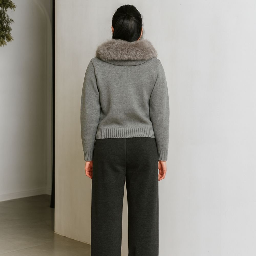 Model wearing Kouvr Fashion gray wool and cashmere blend hooded cardigan with silver fox fur trim