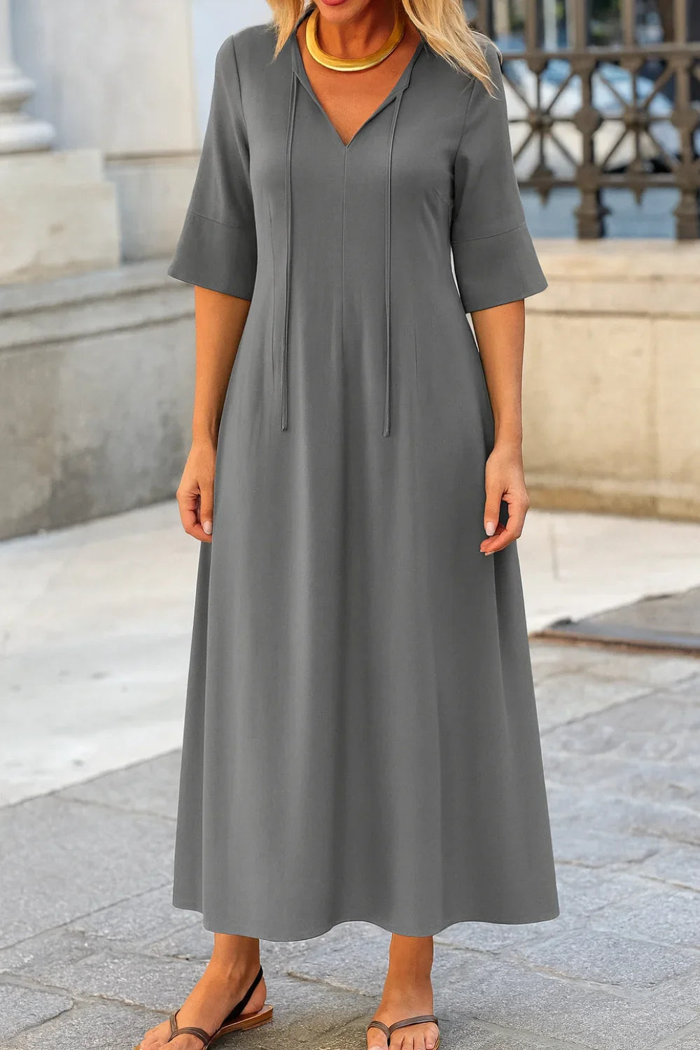 charcoal grey gown," "women's sophisticated travel dress," "minimalist A-line dress," "all-season maxi dress," and "comfortable evening dress