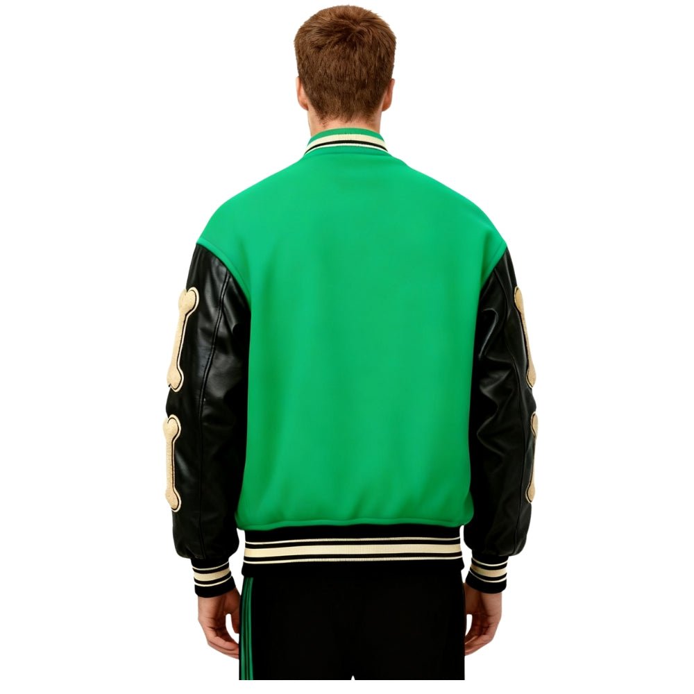 Green Kouvr varsity jacket with black leather sleeves worn by a person on a white background
