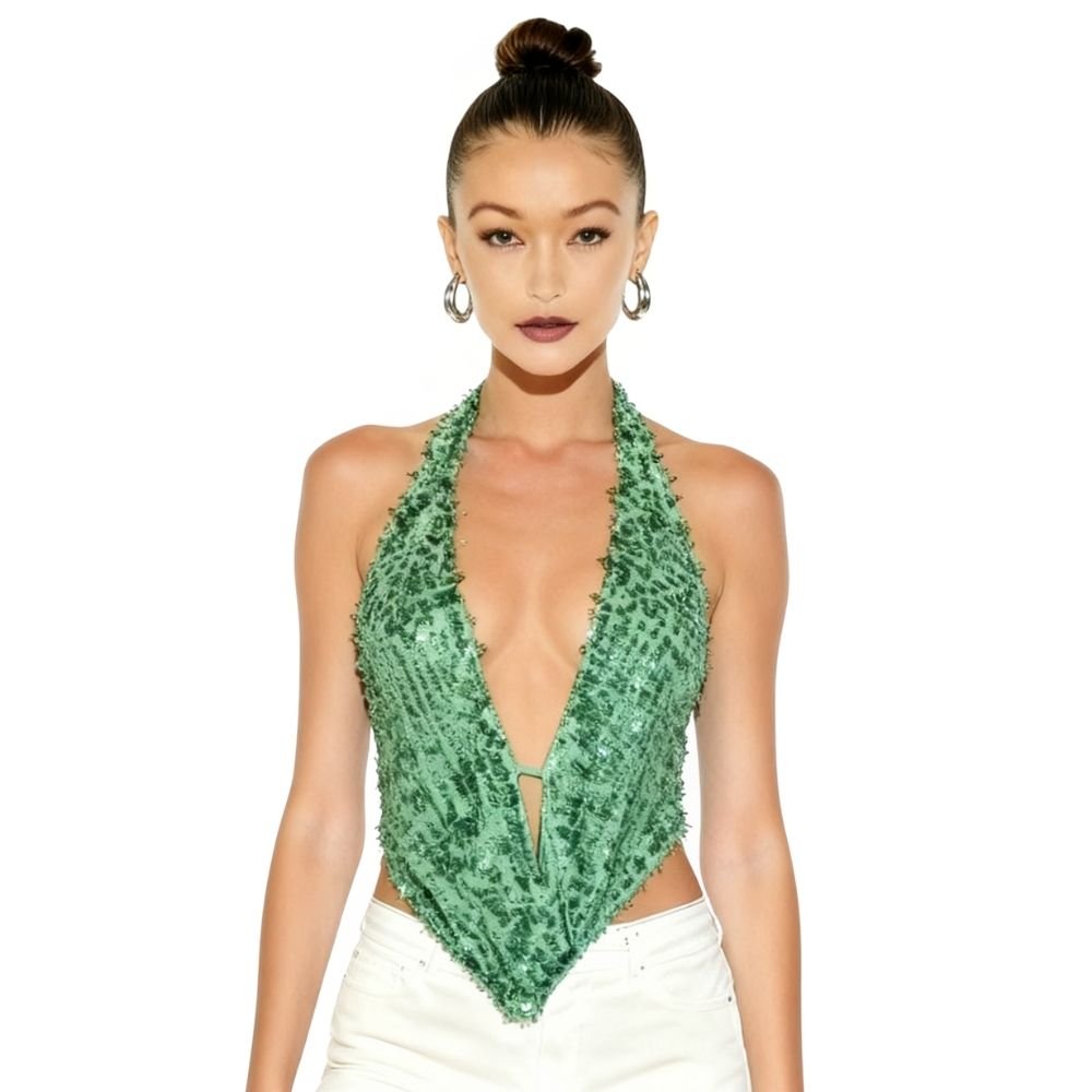 Woman wearing a kouvr green sequin halter top on a white background