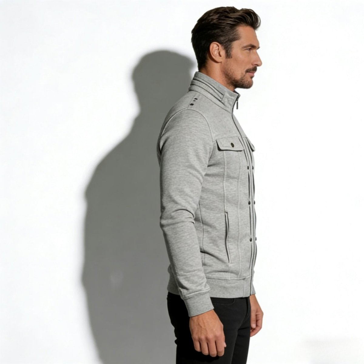 Side view of a man wearing the Kouvr structured cotton jacket, showing the slim fit silhouette and arm details.