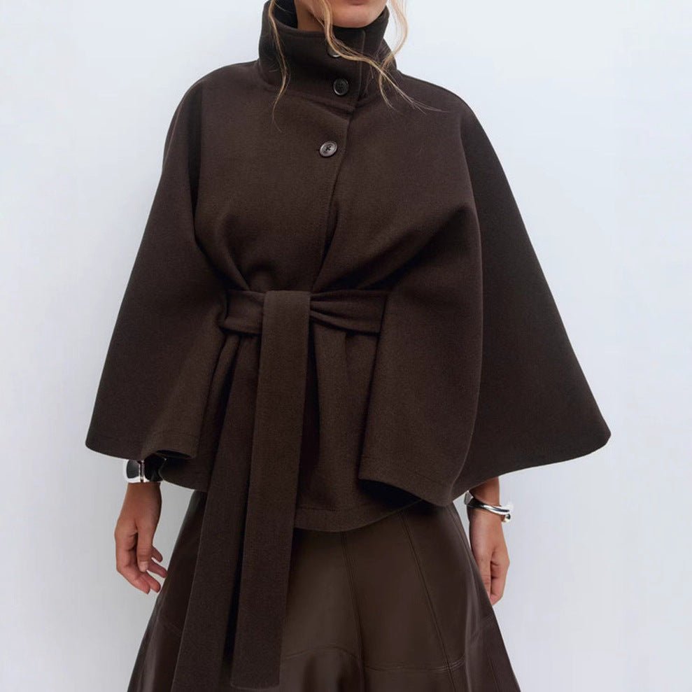 Model wearing the Kouvr Fashion Jannah belted wool cape in espresso brown, featuring a funnel neck and wide waist tie