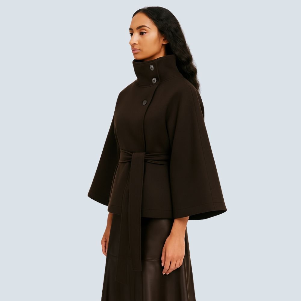 Model wearing the Kouvr Fashion Jannah belted wool cape in espresso brown, featuring a funnel neck and wide waist tie