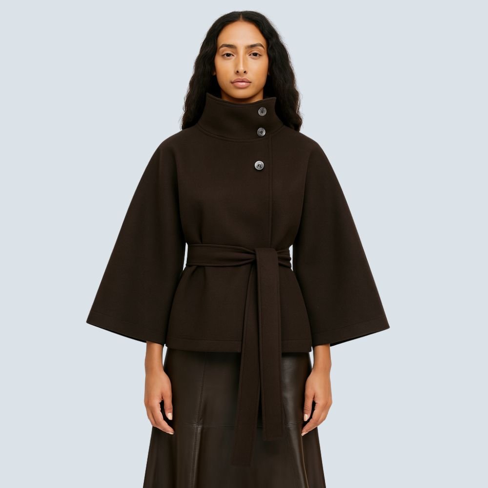 Model wearing the Kouvr Fashion Jannah belted wool cape in espresso brown, featuring a funnel neck and wide waist tie