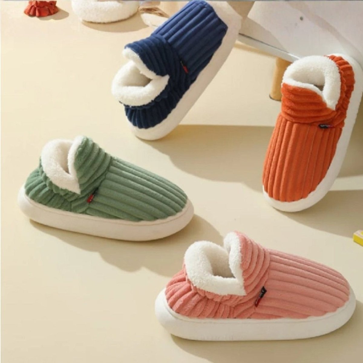 A collection of Kouvr Fashion's Jasmine corduroy slipper boots shown in pink, light green, blue, and orange.