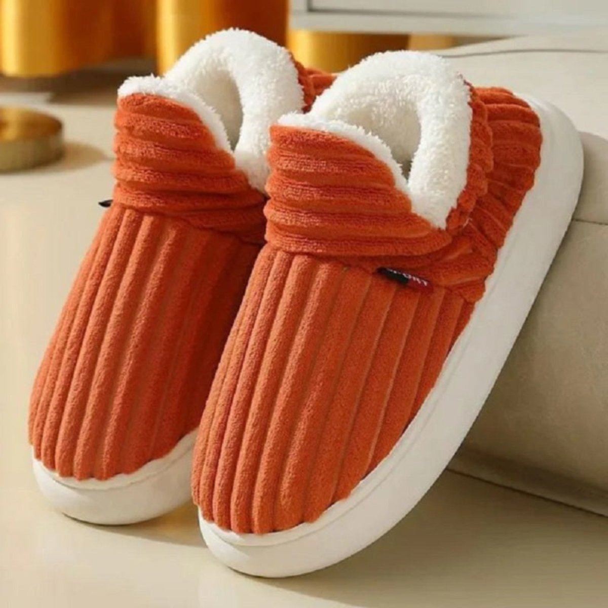 A pair of Orange Jasmine corduroy slipper boots by Kouvr Fashion, highlighting the wide-wale texture and plush sherpa collar.