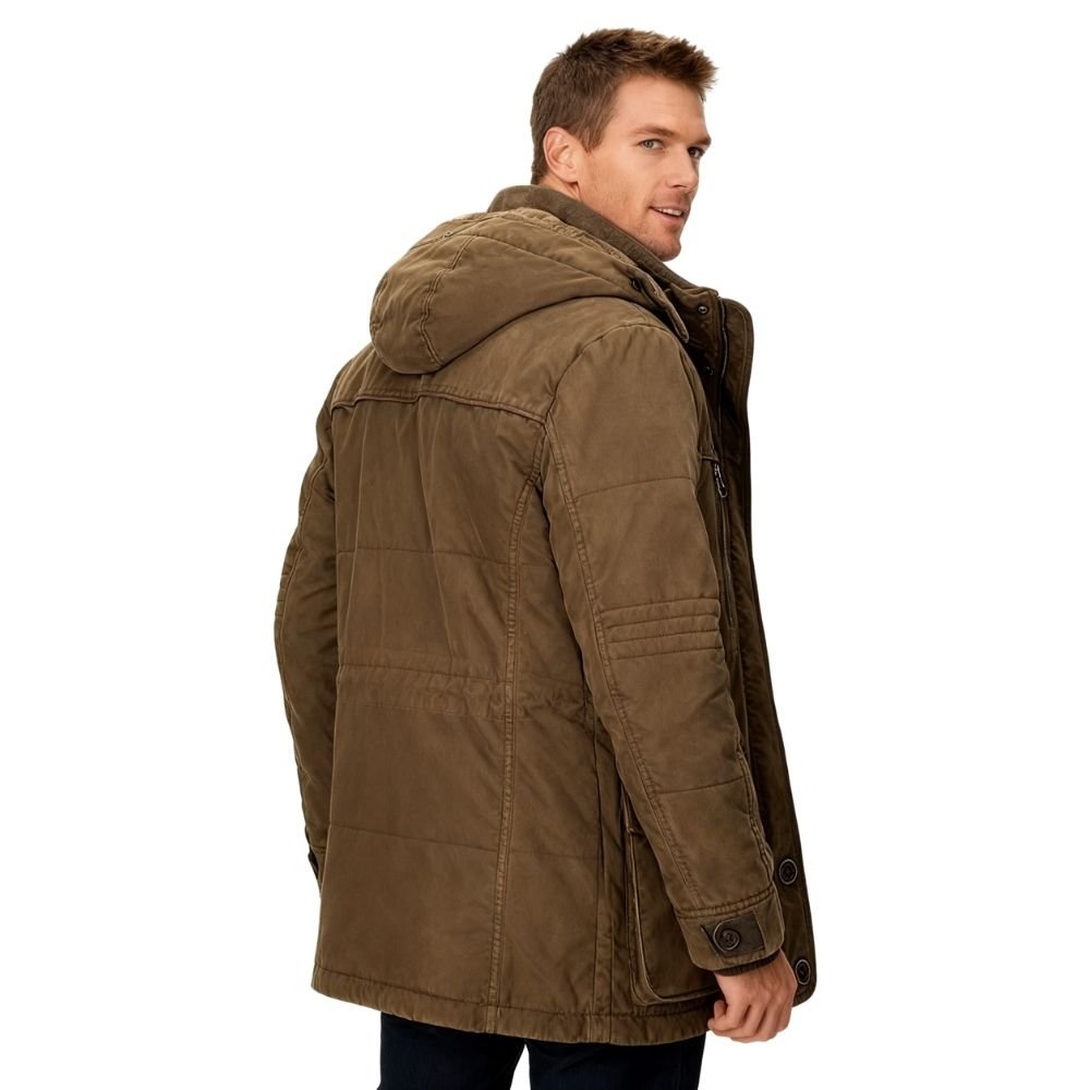Man wearing a brown kouvr parka jacket on a white background