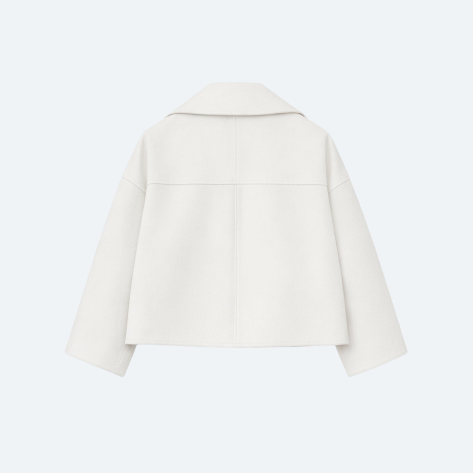 Back view of the Kouvr Fashion Katherine cropped pea coat laid flat, showing the central and yoke seam construction.