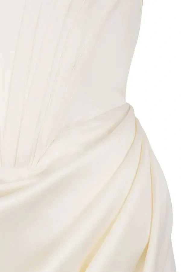 structured bodice, asymmetrical hemline, sweetheart neckline, sculpted silhouette, boning, and figure-flattering