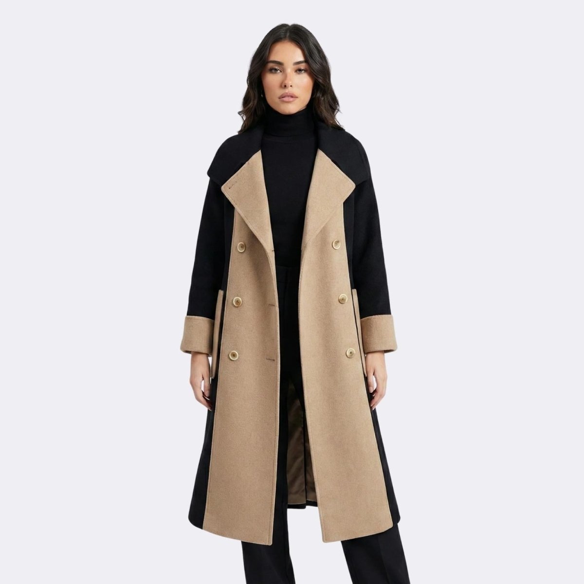 Full front view of a Madison Beer wearing the Kouvr Fashion Madison double-breasted coat open, showcasing the camel lapels and black body.