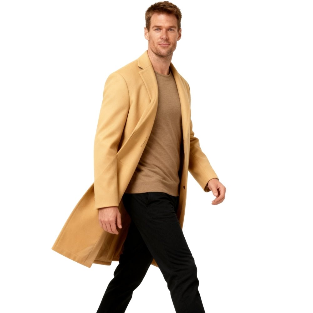 Man wearing a beige Kouvr coat on a white background