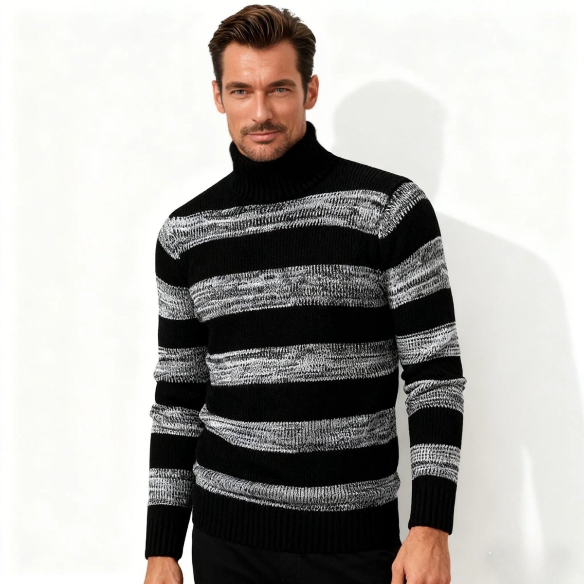 Model wearing the Kouvr Fashion men's black and marled grey striped turtleneck sweater, front view.