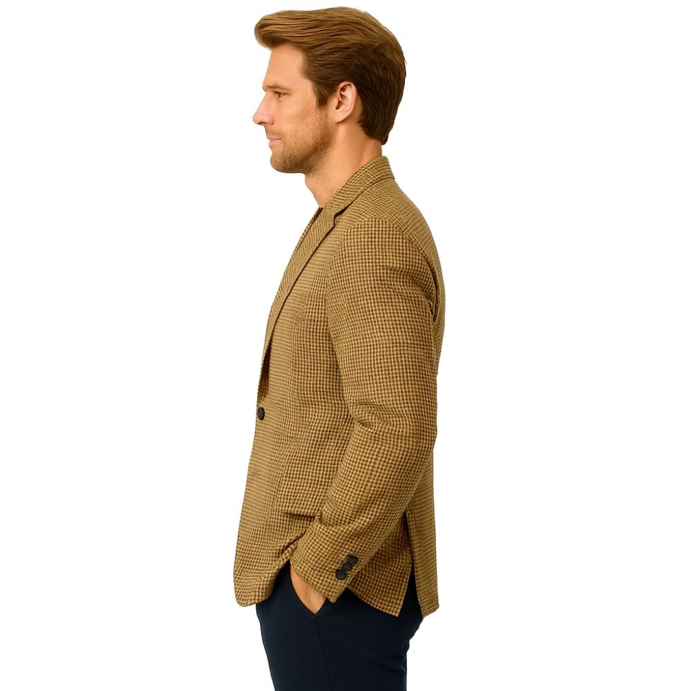 Model wearing Kouvr Fashion brown and black houndstooth blazer with black trousers