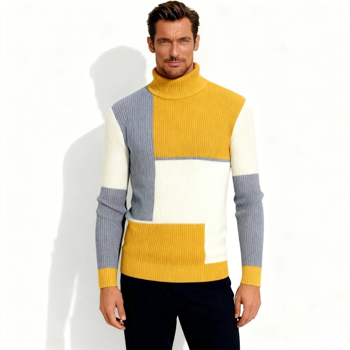 Male model wearing the Kouvr Fashion color-block turtleneck sweater in mustard yellow, white, and cream, front view against a white background.