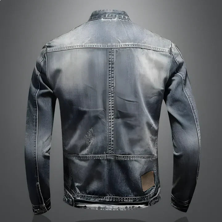 Kouvr denim jacket with a distressed back design on a gray background
