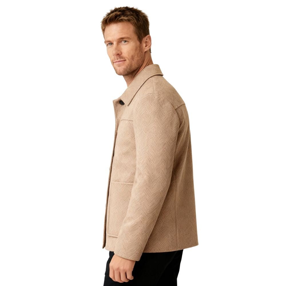 Man wearing a khaki kouvr coat on a white background