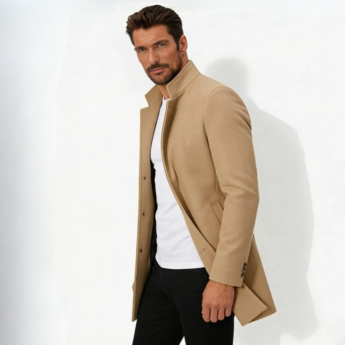 Side profile of a man wearing the Kouvr Fashion khaki wool topcoat showing its tailored fit and sleeve button details.