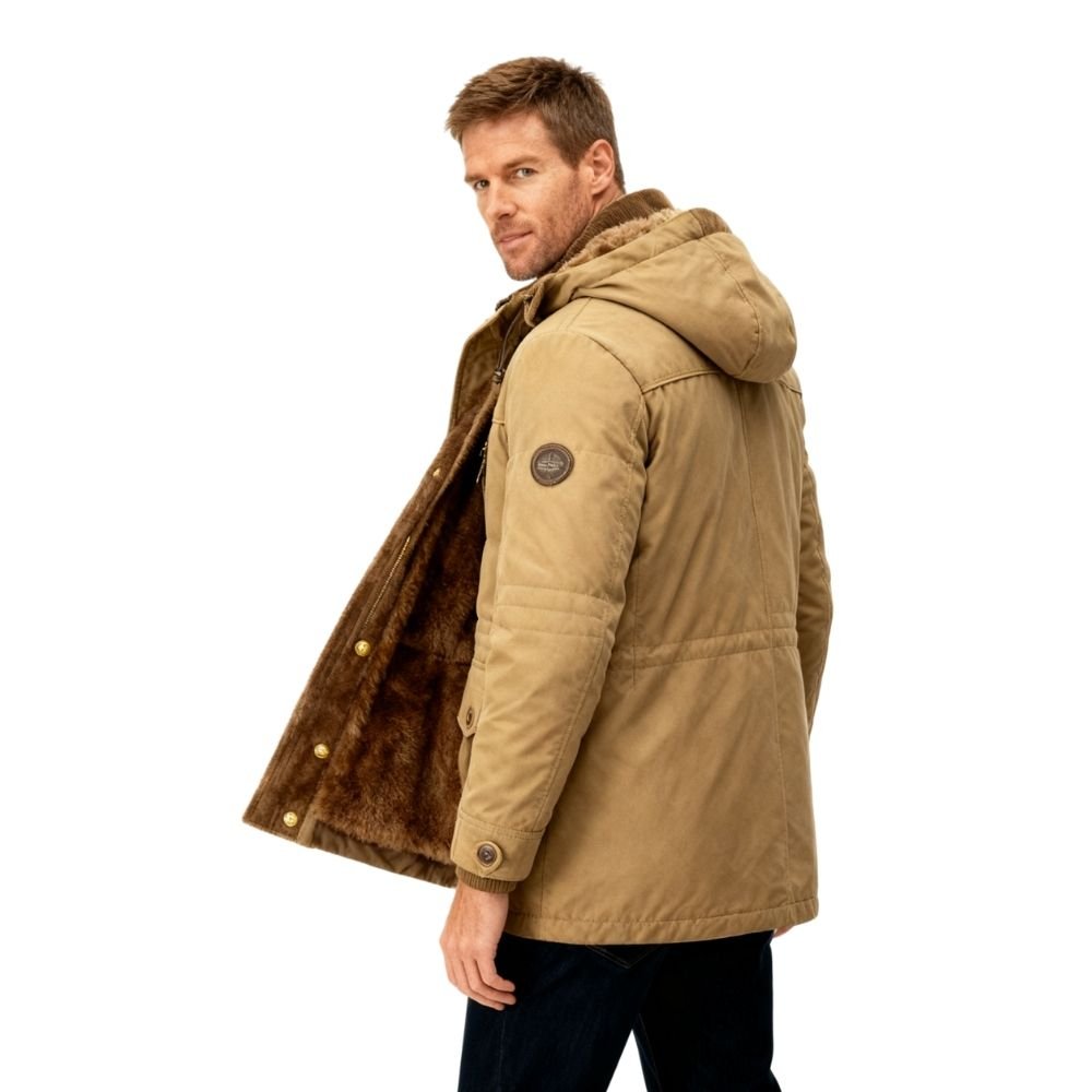 Side profile of a model looking back while wearing the Kouvr Fashion khaki winter parka, showing the thick brown sherpa fleece lining.