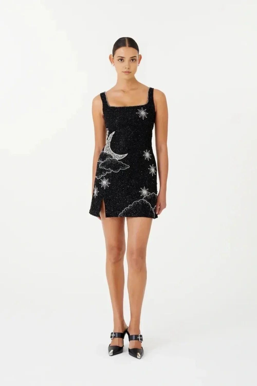 astrological embroidery," "embellished little black dress," "cosmic cocktail attire," and "night sky dress