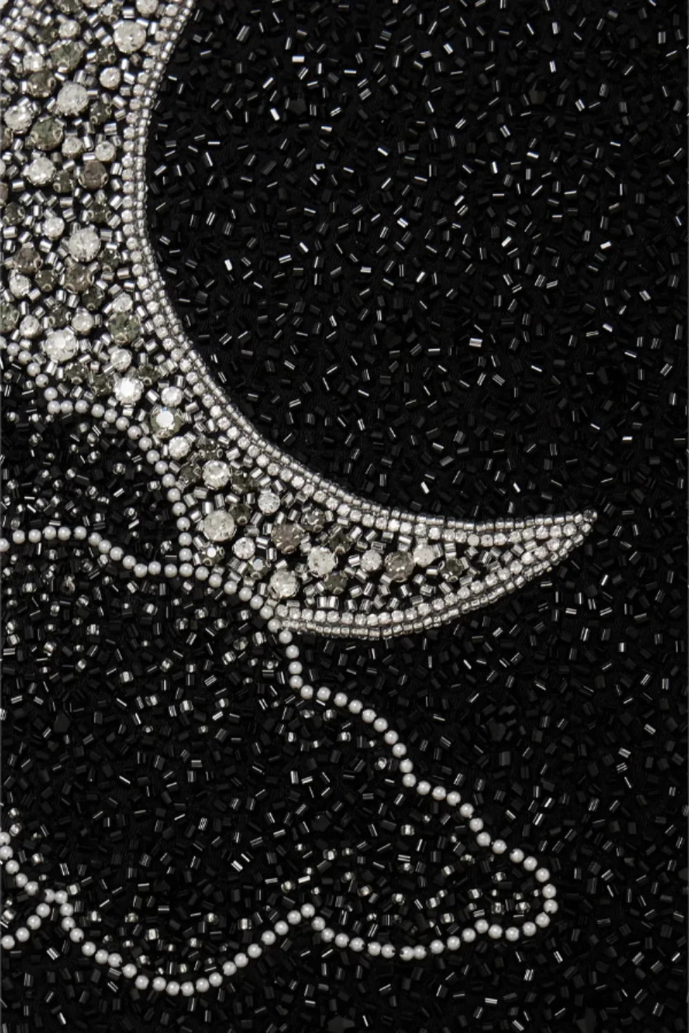 astrological embroidery," "embellished little black dress," "cosmic cocktail attire," and "night sky dress