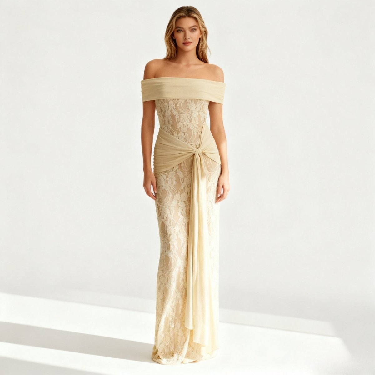 Woman wearing a yellow Kouvr off-shoulder lace gown on a white background