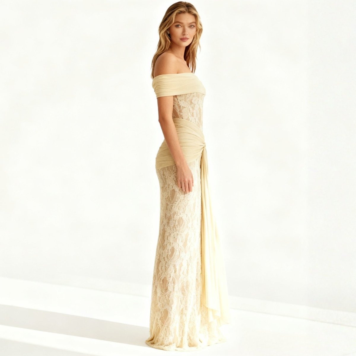 Woman wearing a yellow Kouvr off-shoulder lace dress on a white background