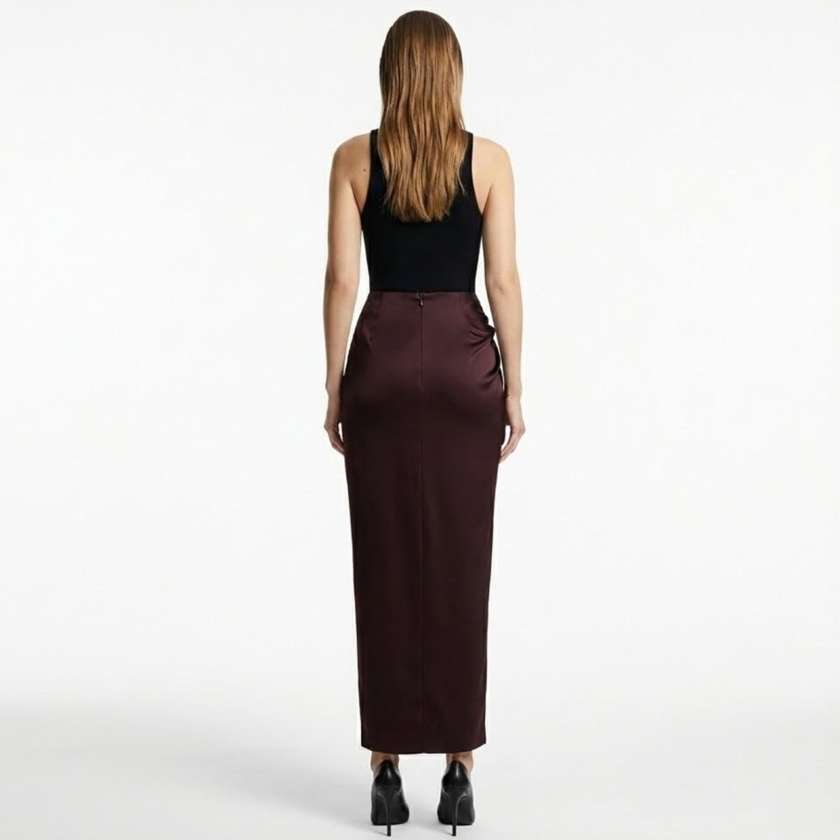 Back view of the Ourania high-waist satin trousers showcasing the smooth, tailored fit from behind.