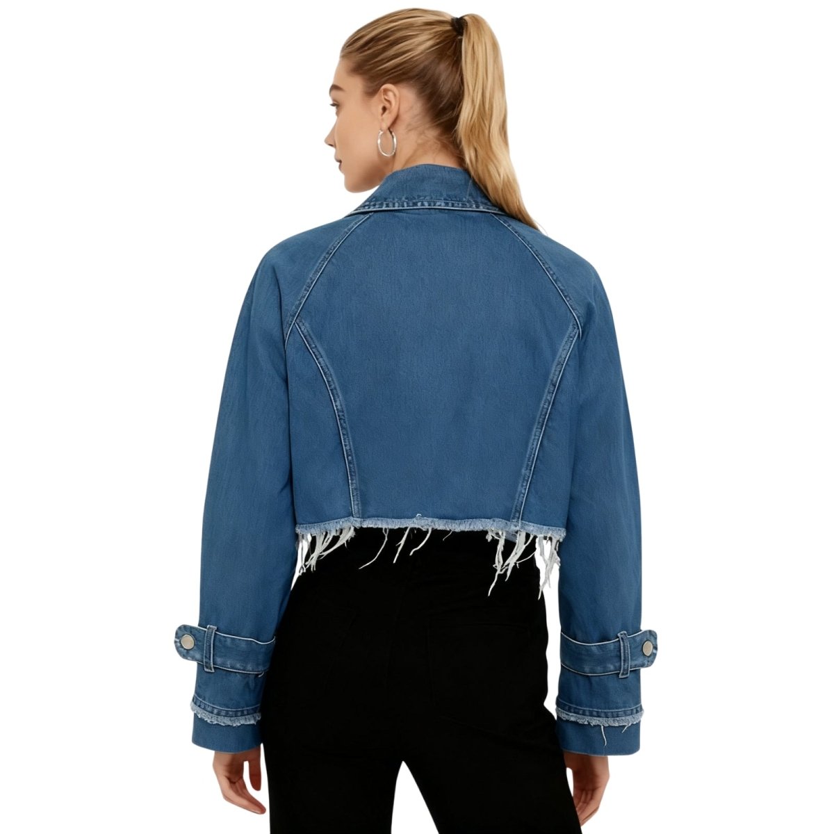 A woman in a street style setting wearing the Kouvr Fashion oversized blue denim jacket .