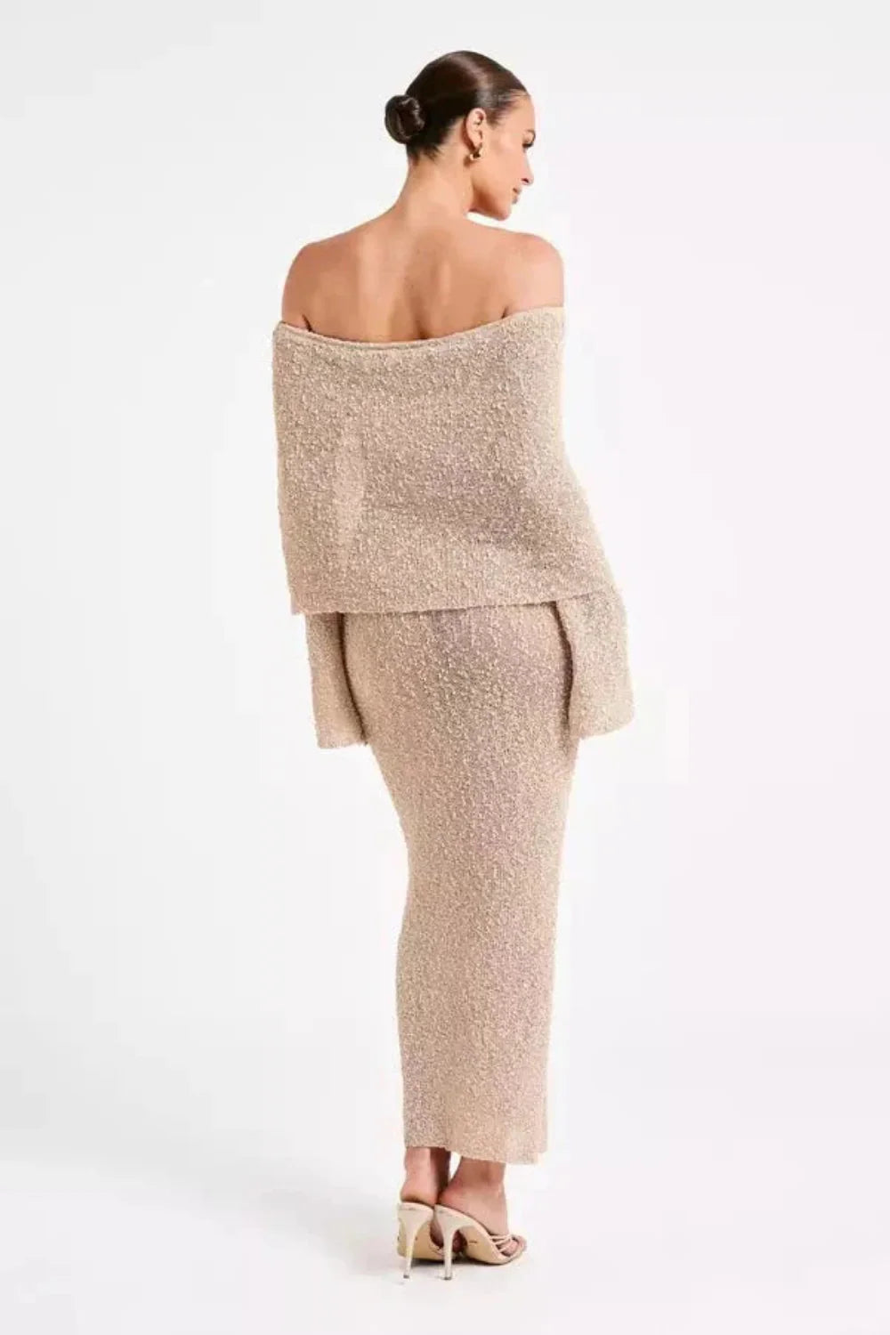 Model wearing the Kouvr Selah off-shoulder knit maxi dress in beige sand