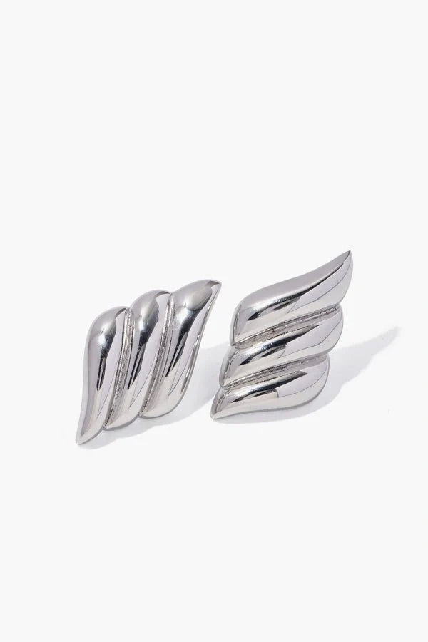 A pair of Kouvr Fashion silver sculptural earrings displayed against a clean white background.
