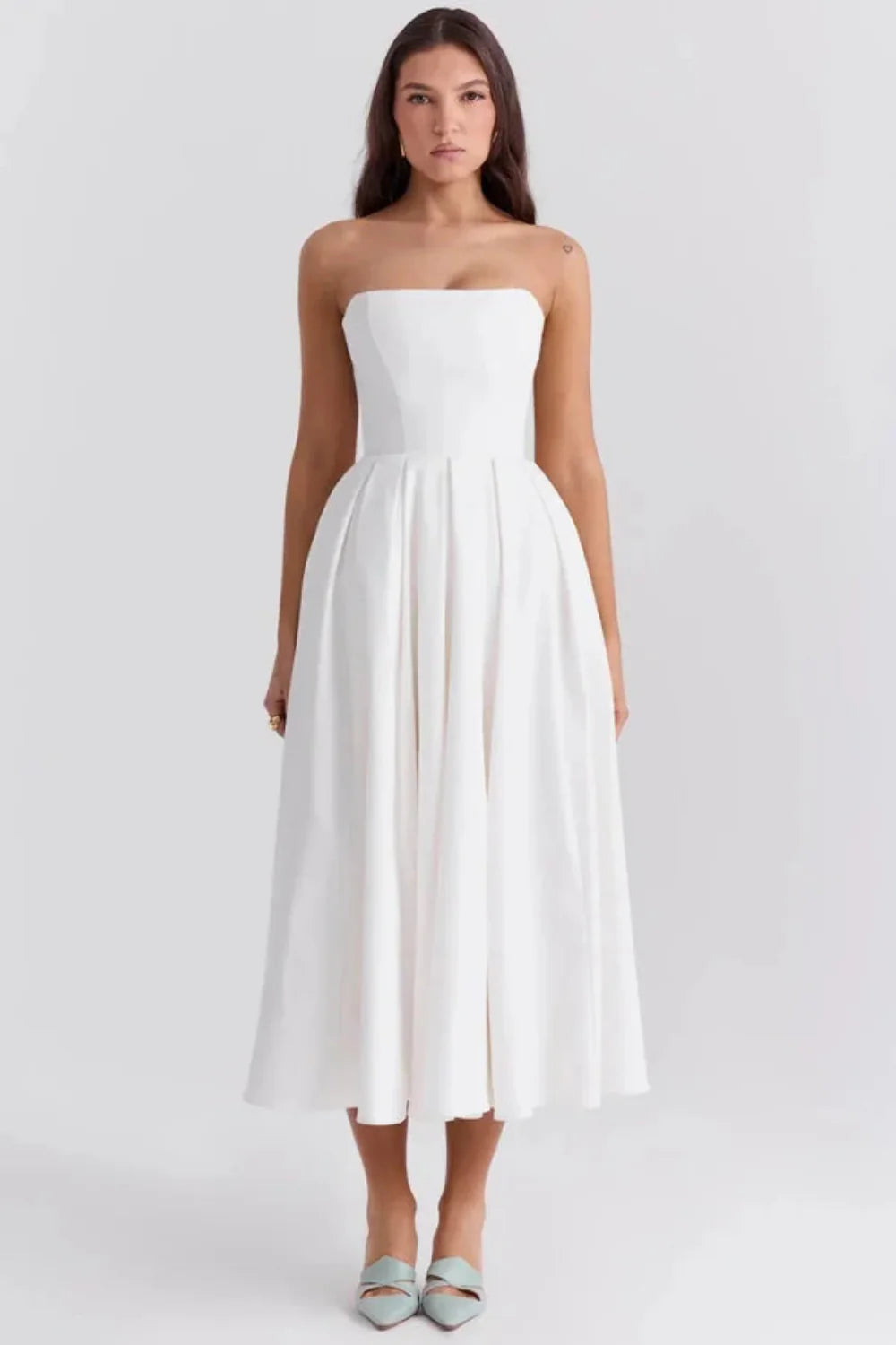 Kouvr Fashion white strapless midi dress with pleated A-line skirt shown on model