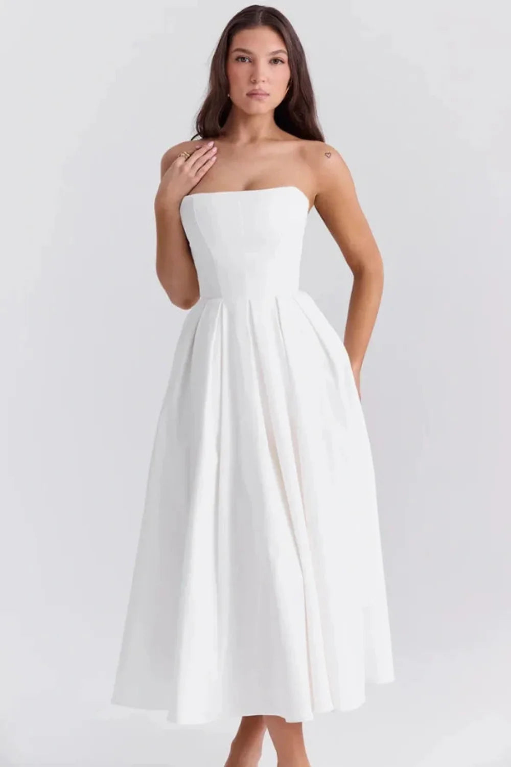 Kouvr Fashion white strapless midi dress with pleated A-line skirt shown on model