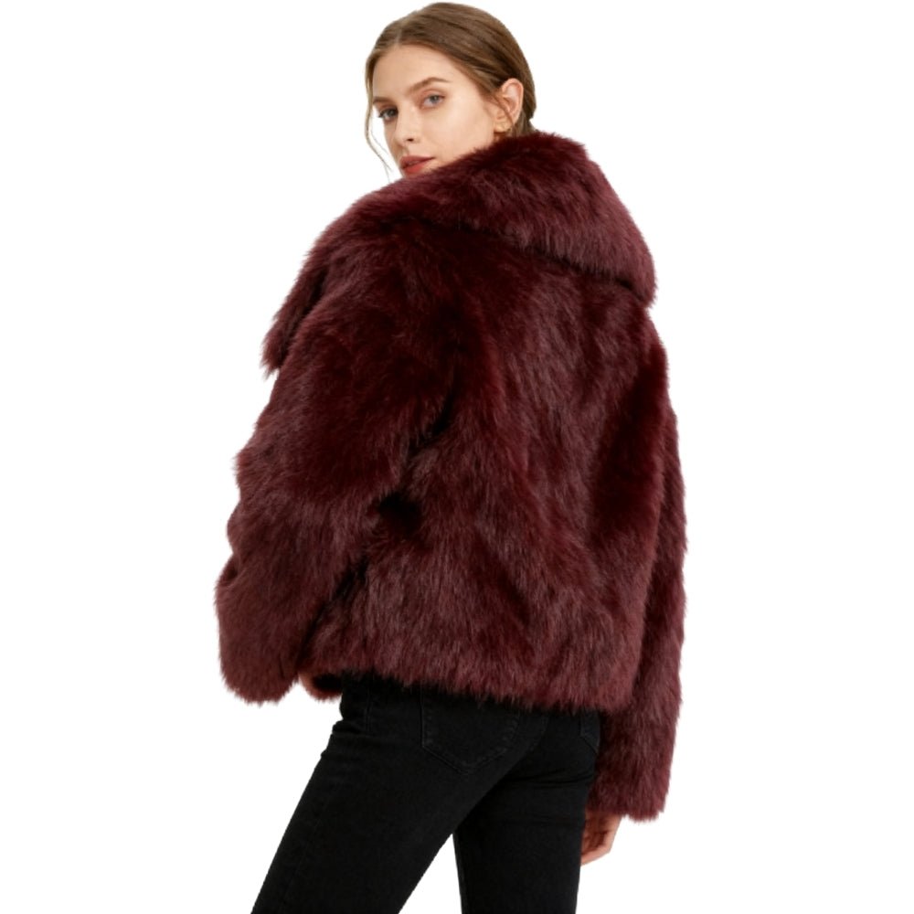 Model wearing the Kouvr Fashion Bordeaux oversized burgundy faux fur coat with a white top and blue jeans