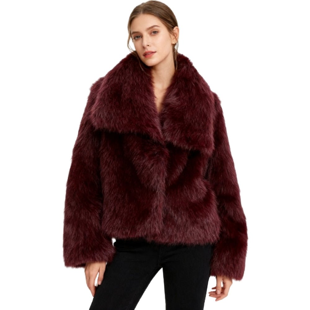 Model wearing the Kouvr Fashion Bordeaux oversized burgundy faux fur coat with a white top and blue jeans