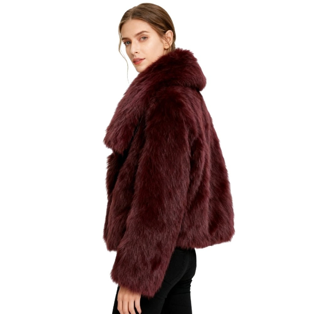 Model wearing the Kouvr Fashion Bordeaux oversized burgundy faux fur coat with a white top and blue jeans