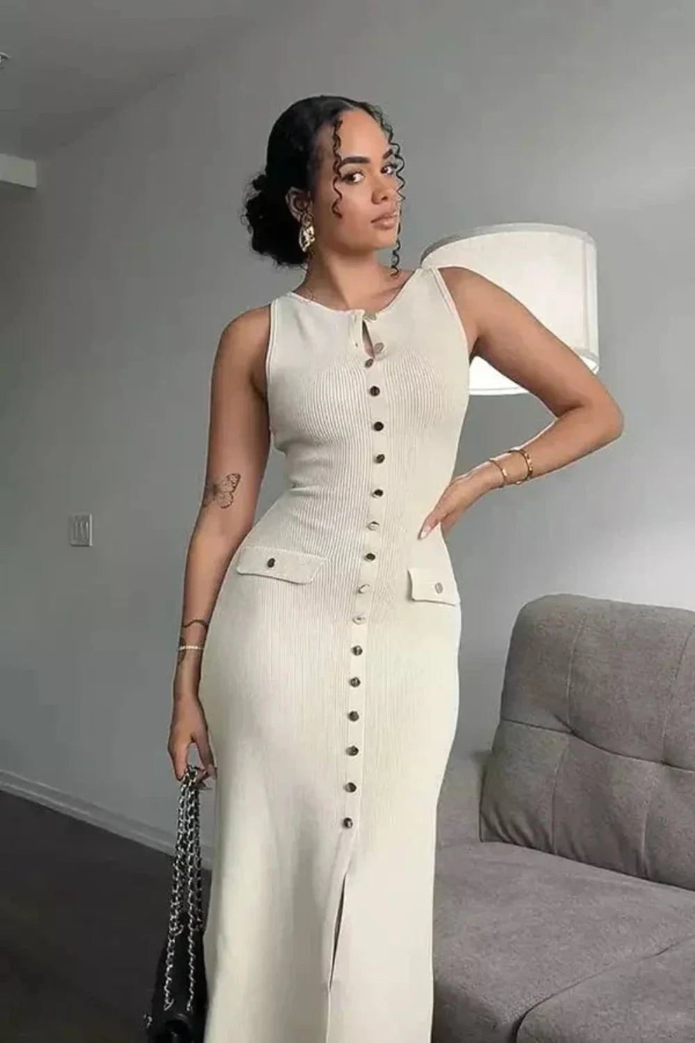 Model wearing the Kouvr Fashion Fiorella white ribbed knit button-front midi dress