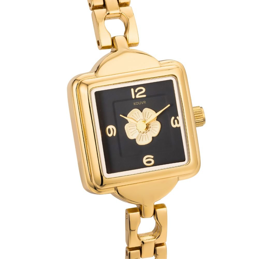 Gold kouvr watch with black face on a white background