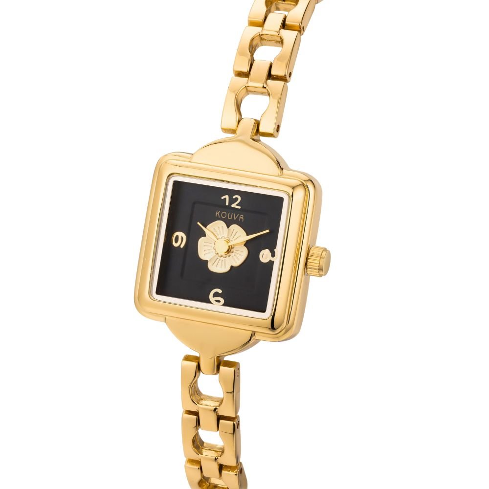 Gold kouvr wristwatch with a black face on a white background
