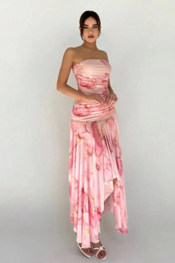 Model wearing the Kouvr Floretta pink floral ruched strapless dress with an asymmetrical chiffon skirt