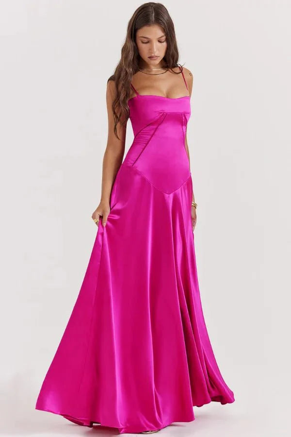 Model wearing the Kouvr Gabriella Gown in Fuchsia Satin with a lace-up corset back.