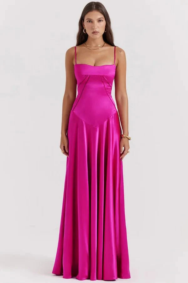 Model wearing the Kouvr Gabriella Gown in Fuchsia Satin with a lace-up corset back.