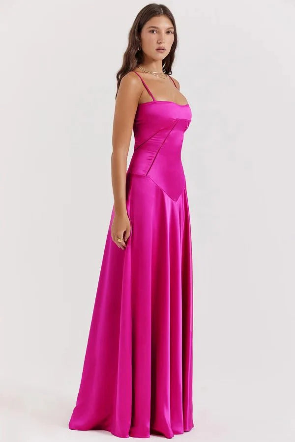 Model wearing the Kouvr Gabriella Gown in Fuchsia Satin with a lace-up corset back.