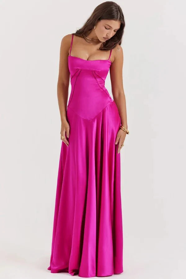 Model wearing the Kouvr Gabriella Gown in Fuchsia Satin with a lace-up corset back.